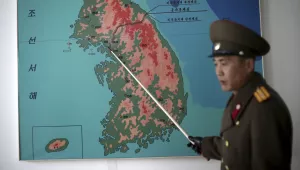 North Korean People's Army Lt. Col. Nam Dong Ho points to a map showing the line which separates the two Koreas in Panmunjom at the Demilitarized Zone (DMZ), February 22, 2016, in Panmunjom, North Korea. (AP Photo/Wong Maye-E)