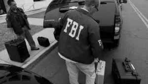 FBI agents leave a raid in Trenton, N.J. on July 19, 2012