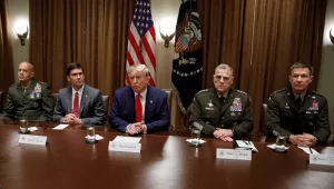 President Donald Trump, joined by from left, Gen. David Berger, Defense Secretary Mark Esper, and Chairman of the Joint Chiefs of Staff Gen. Mark Milley, and Gen. Joseph M. Martin, pauses as he speaks to media during a briefing with senior military leaders in the Cabinet Room at the White House in Washington, Monday, Oct. 7, 2019.