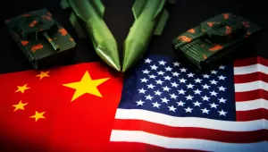 Photo of China and U.S. flags with military items