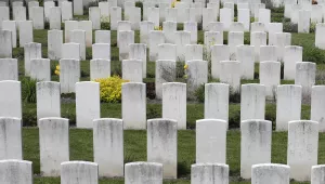 Flowers bloom around graves of World War I soldiers prior to a foundation laying ceremony at Loos British Cemetery in Loos-en-Gohelle, France, Thursday, May 4, 2023. 