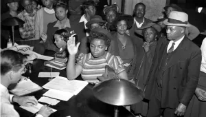 Black Americans register to vote in the July 4 Georgia Democratic Primary in Atlanta, Ga., on May 3, 1944. Registrations are increasing in Atlanta as black schools are giving instructions to students in ballot casting procedure.