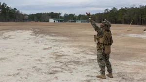 U.S. Marine Corps Lance Cpl. Donte Mathews flies an unmanned aircraft system during a mortar range on Camp Lejeune, North Carolina, Jan. 17, 2023.