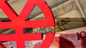 A e-CNY symbol in the foreground with a 100 Yuan note and 100 Dollar bill in a collage behind it with a shot of the Federal Reserve building in the background.