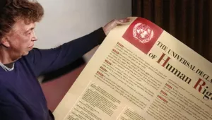 Eleanor Roosevelt holding a poster of the Universal Declaration of Human Rights