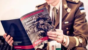 Estonian Military Officer reading NATO at 70