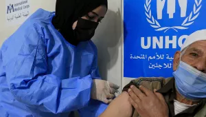 A Syrian refugee receives the Chinese-made Sinopharm coronavirus vaccine at a medical center in the Zaatari refugee camp, in Mafraq, about 80 km (50 miles) north of the Jordanian capital Amman, Monday, Feb. 15, 2021.