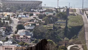 The US-Mexico border fence with Tijuana, Mexico, on the left, the Pacific Ocean in the background