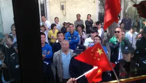 Protesters on demonstration bus interacting with police and pedestrians during 918 Shenyang Anti-Japan Demonstration, September 18, 2012.