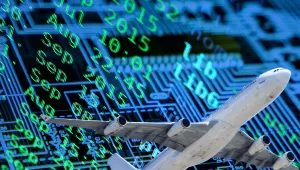 An image of a passenger airplane superimposed on computer code and a computer chip.
