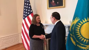 Kazakh Ambassador Erzhan Kazykhanov thanks Ambassador Laura Holgate for her service to his country.