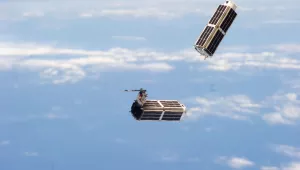 A set of NanoRacks CubeSats is photographed by an Expedition 38 crew member after the deployment by the Small Satellite Orbital Deployer (SSOD).