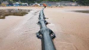 Final installation of Marea transatlantic undersea cable on shore in Bilbao, Spain.