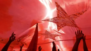 Protesters hold up a giant Chinese national flag during protests outside the Japanese embassy in Beijing, China, Saturday, Sept. 15, 2012.