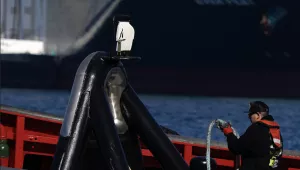 A worker is seen in a tugboat at the Port of Los Angeles on Nov. 10, 2021.