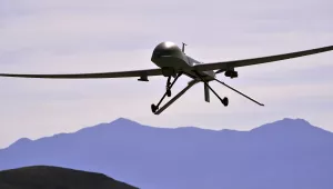An MQ-1B Predator remotely piloted aircraft passes over the air field during a training mission, Creech Air Force Base, Nevada, May 13, 2013. 