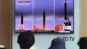 People at Seoul Train Station watch a a local news program reporting about a North Korean missile launch. Aug. 30, 2017 (Lee Jin-man/Associated Press).