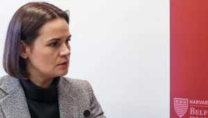 Q&A with Sviatlana Tsikhanouskaya at left with a crimson Belfer Center banner at right