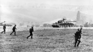 Military exercise 'October Storm': Soviet soldiers march forward protected by T-54 tanks on the second day of the exercise of the Warsaw Pact member Staates, October 22, 1965 simulating an attack in the Thuringian Forest in the German Democratic Republic (East Germany).
