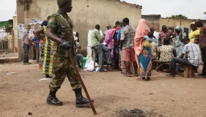 A Soldier stand guard as voters cast their vote during the gubernatorial election in Kaduna, Nigeria, Thursday, April 28, 2011. Two states in Nigeria's Muslim north voted Thursday for state gubernatorial candidates after their polls were delayed by violence that killed at least 500 last week after the oil-rich nation's presidential election.