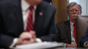National security adviser John Bolton listens as President Donald Trump speaks