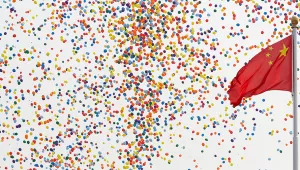 Balloons float past a Chinese flag on Tiananmen Square after being released during a parade commemorating the 70th anniversary of the founding of Communist China in Beijing, Tuesday, October 1, 2019.