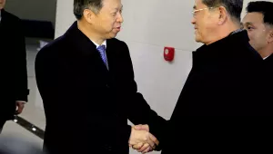 Song Tao, left, head of the International Liaison Department of the Central Committee of the Communist Party of China, is greeted by Ri Chang Gun, vice department director of the C.C., Workers' Party of Korea after arriving with his delegation, Nov. 17, 2017, in Pyongyang
