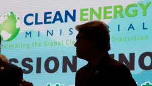 U.S. Energy Secretary Rick Perry is silhouetted near the words "Clean Energy"