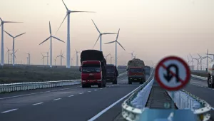 Windmills operate at the Da Bancheng Wind Farm, Xinjiang, China