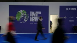 Delegates walk through the venue of the COP26 U.N. Climate Summit in Glasgow, Scotland