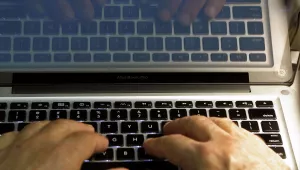  In this Feb. 27, 2013, file photo illustration, hands type on a computer keyboard in Los Angeles