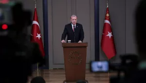 Turkey's President Recep Tayyip Erdogan talks to members of the media 