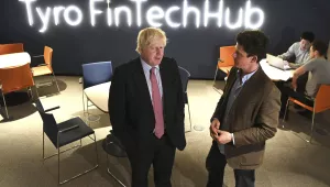 British Foreign Secretary Boris Johnson, left, speaks with Head of Tyro Fintech Hub, Andrew Corbett-Jones during a visit to the Tyro Fintech technology Hub in Sydney, July 26, 2017. (William West/Pool Photo via AP)