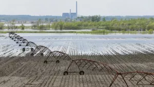 An irrigation pivot stands in flood waters