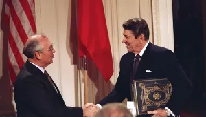 U.S. President Ronald Reagan, right, shakes hands with Soviet leader Mikhail Gorbachev