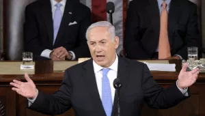 Israeli Prime Minister Benjamin Netanyahu gestures while addressing a joint meeting of Congress on Capitol Hill in Washington, Tuesday, May 24, 2011. Vice President Joe Biden, left, and House Speaker John Boehner of Ohio, right, listen.