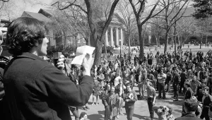 A student leader exhorts Harvard undergraduates from steps of the Administration building