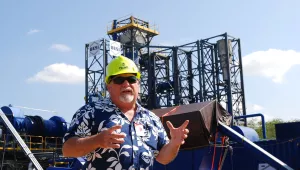 Stan Osserman, director of the Hawaii Center for Advanced Transportation Technologies, speaks in front of a new waste to energy facility at Joint Base Pearl Harbor-Hickam, Hawaii. 