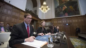 Richard Visek, left, agent of the U.S.A. and members of the U.S. delegation waits for judges to enter the International Court of Justice