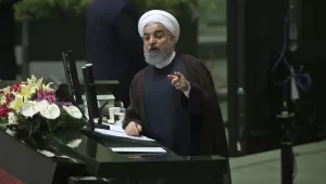 Hassan Rouhani speaks in a session of parliament