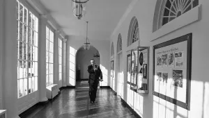 President Lyndon Johnson walks down a White House corridor