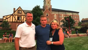 Photo of James, Jonathan, and Mary Winnefeld on the University of Denver campus.
