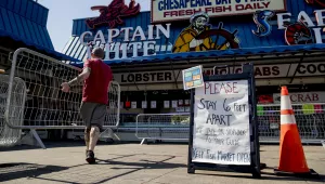 man helps set up portable fencing 