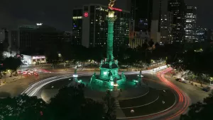 Angel of Independence monument, lit up in green in Mexico City