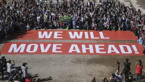 Participants at the COP22 climate conference stage a public show of support for climate negotiations and Paris agreement