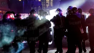 Authorities disperse protesters out of a park in Kenosha, Wisconsin on August 25, 2020.