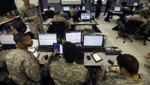U.S. Military Academy cadets watch data on computers