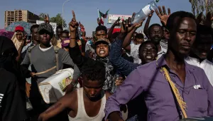 demonstraters rally near the military headquarters in Khartoum, Sudan