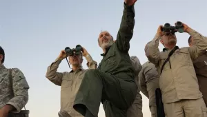 Maj. Gen. Mohammad Bagheri, left looking into binoculars, and other senior officers from the Iranian military