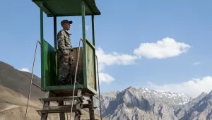 A Tajik conscript looks out over remote stretches of northern Afghanistan from a border outpost near Khorog, Tajikistan.